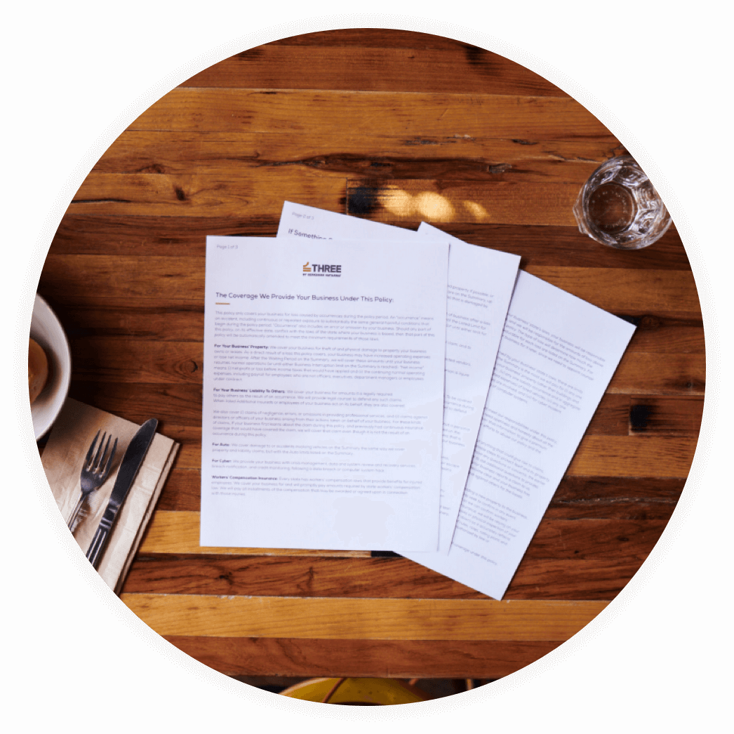 THREE policy pages on a table